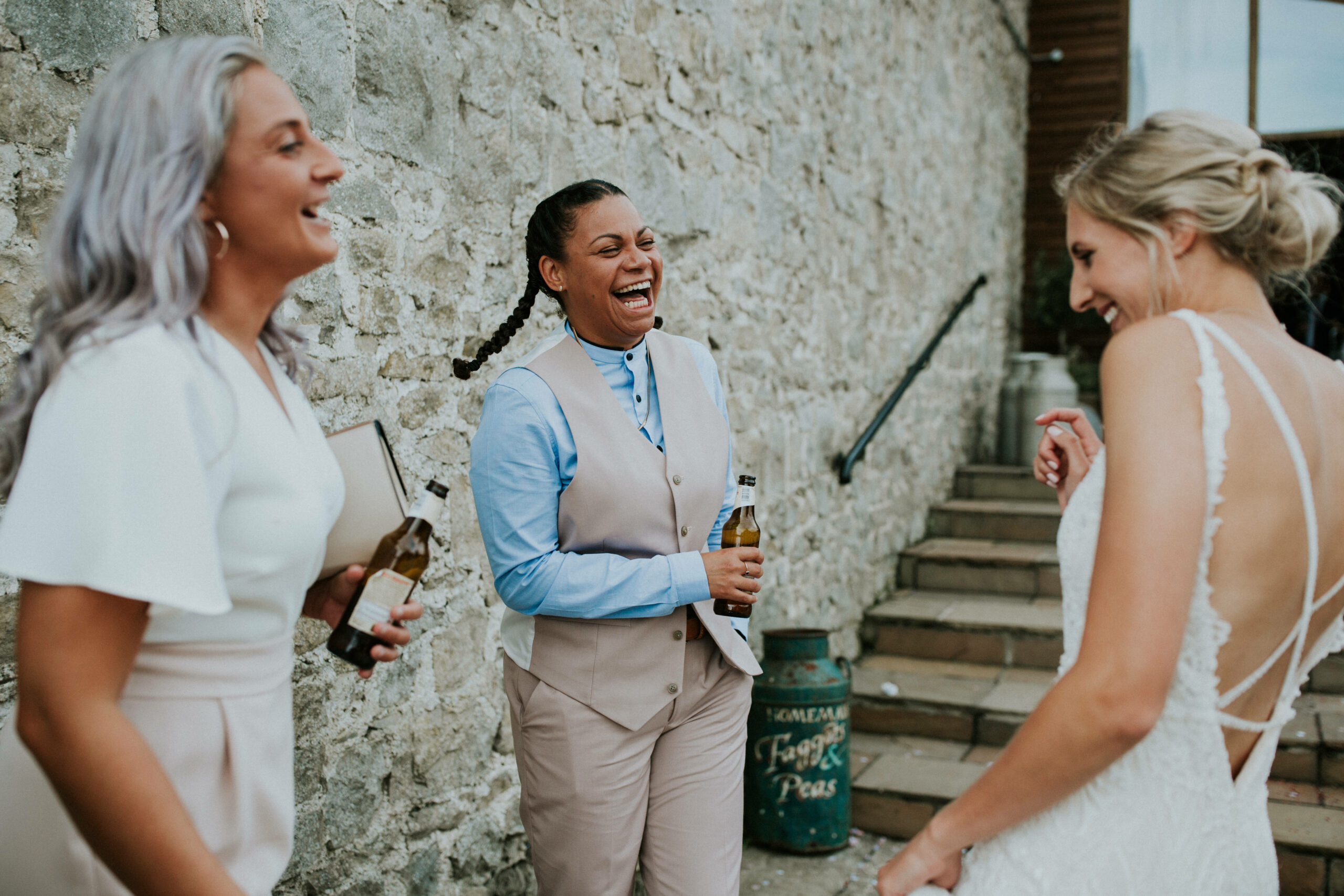 bride and her friends laughing 