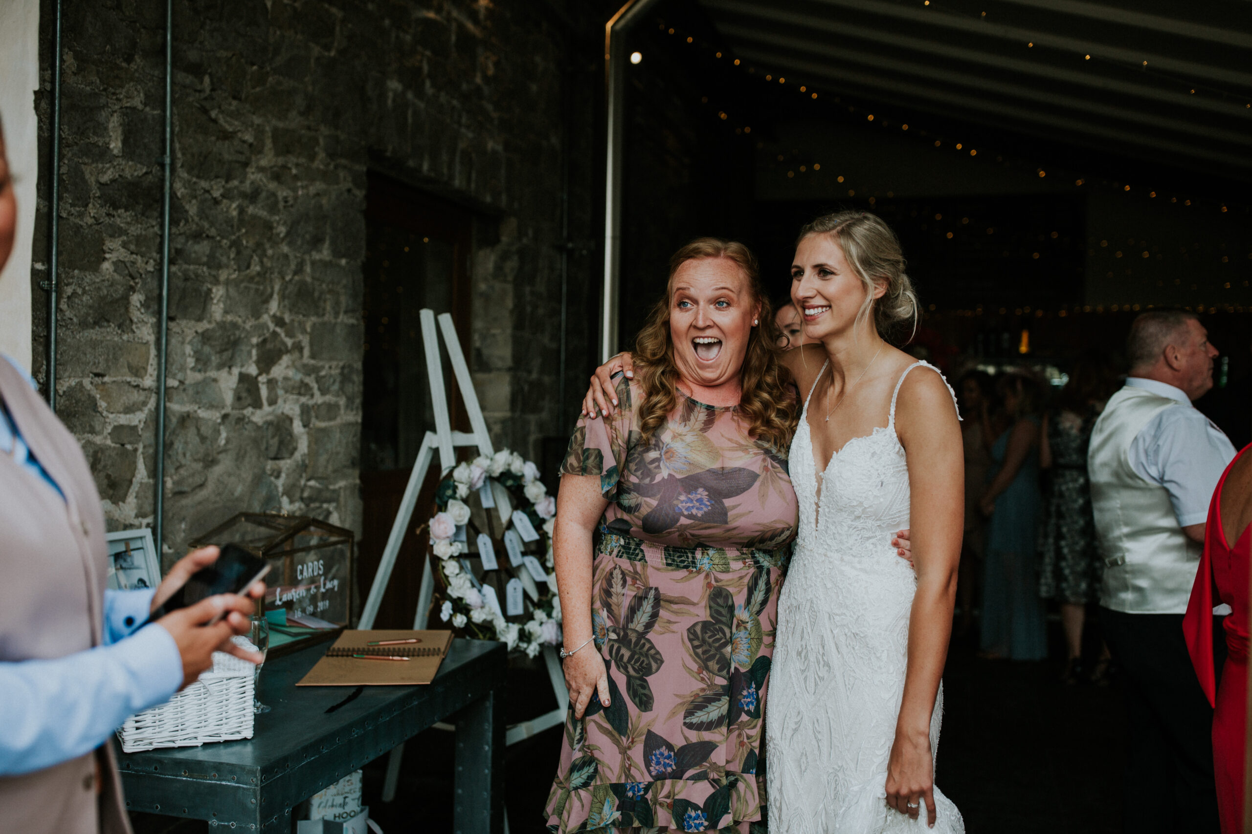 bride and her guest smiling 