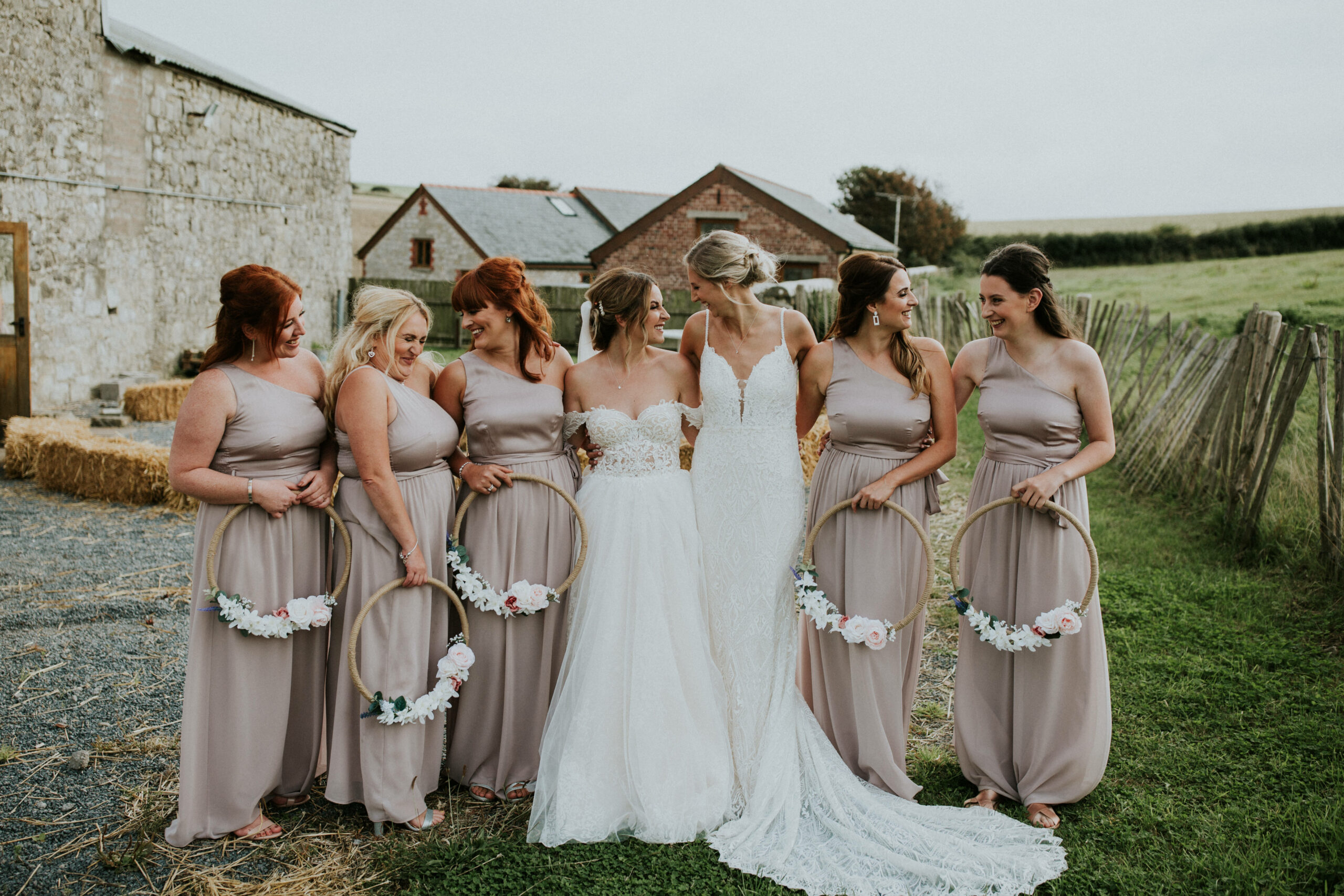 bridesmaids looking at each other and laughing 