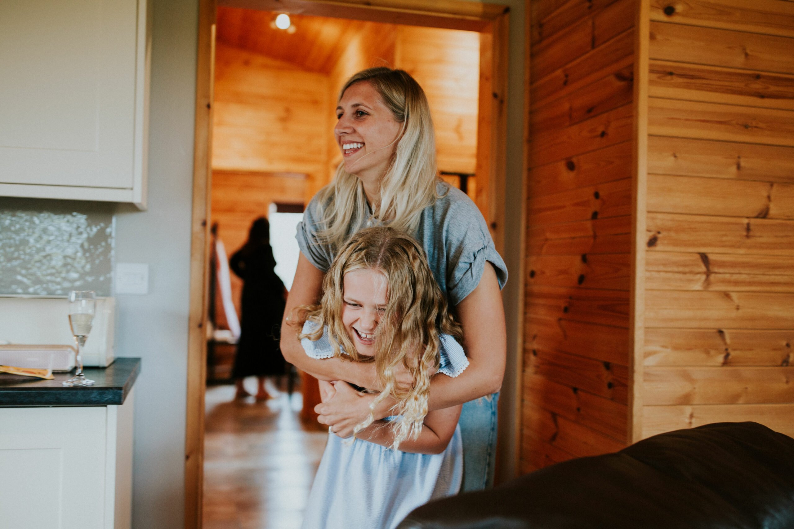 bride and the flower girl hugging 