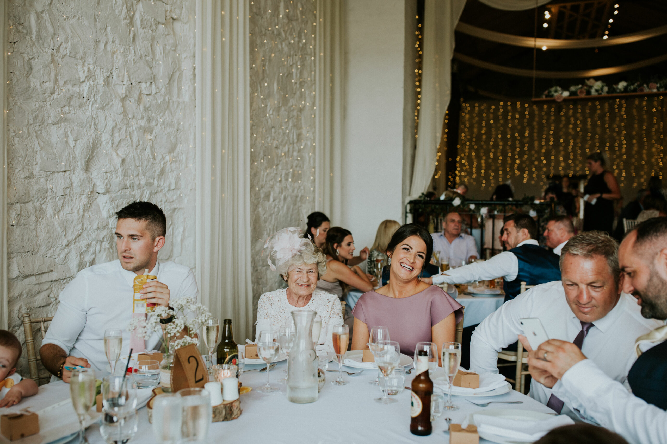 guests laughing at the speeches 