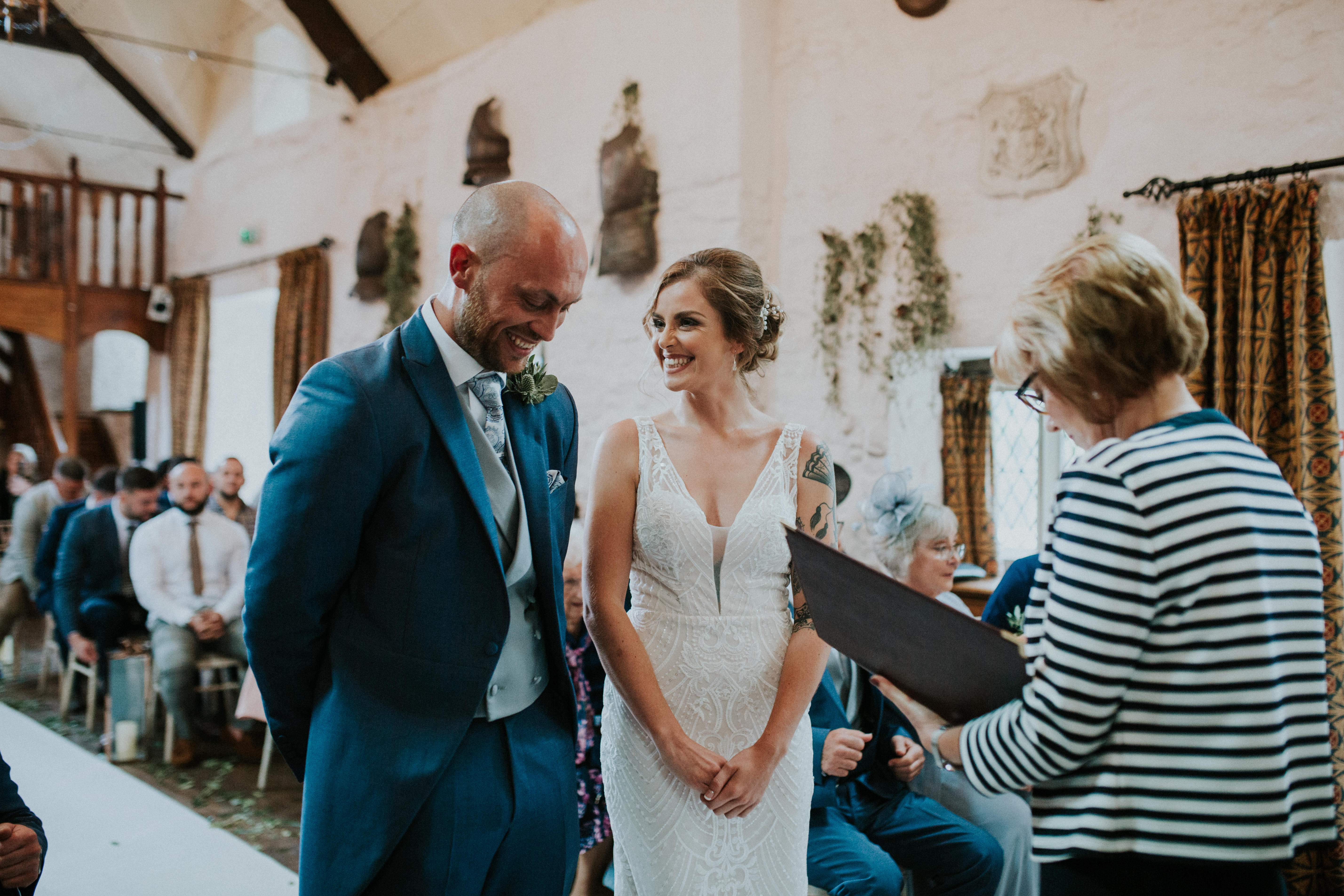 bride smiling at groom 