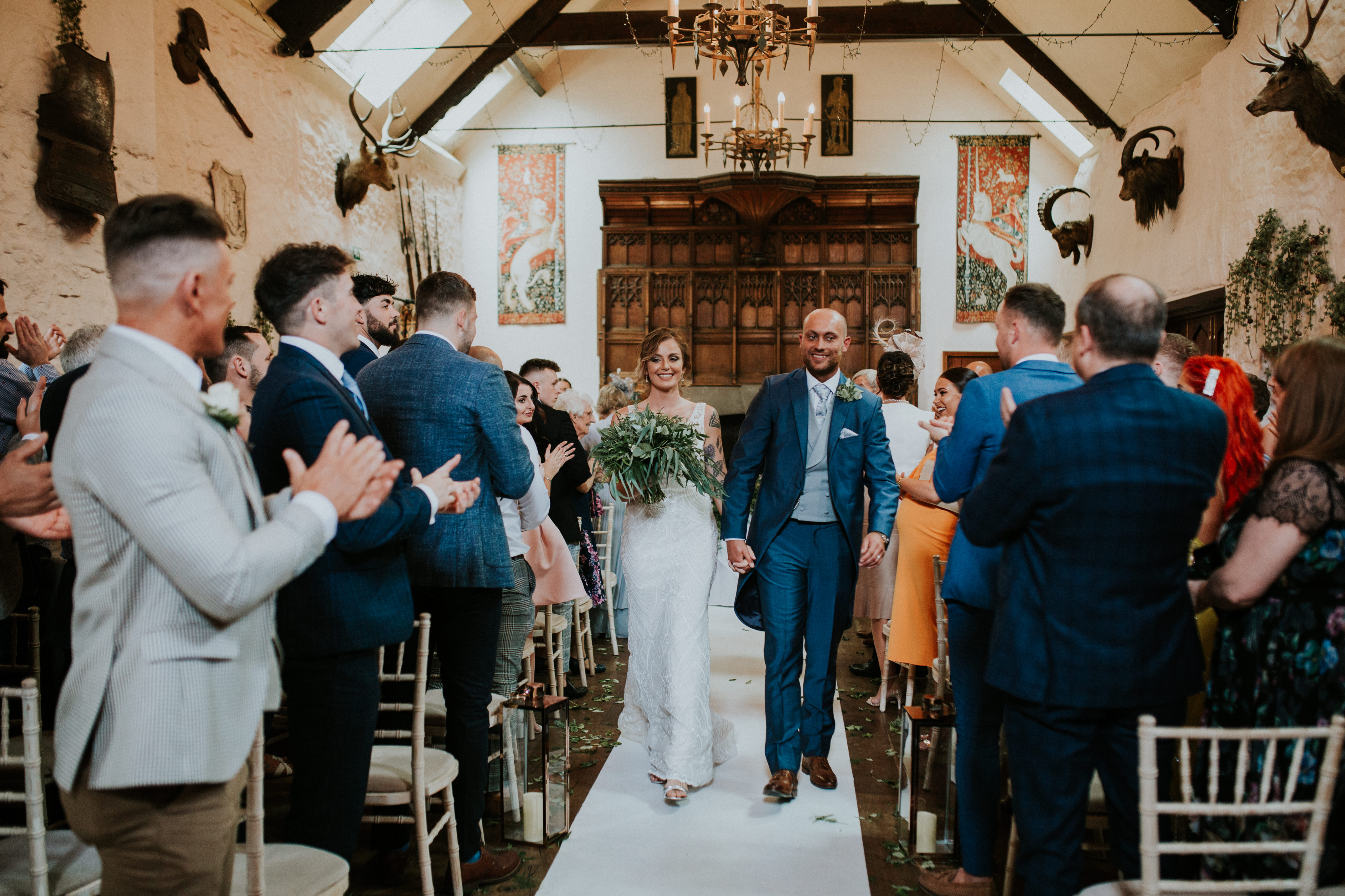 couple walking back down the aisle 