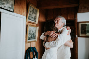 Dad hugging bride