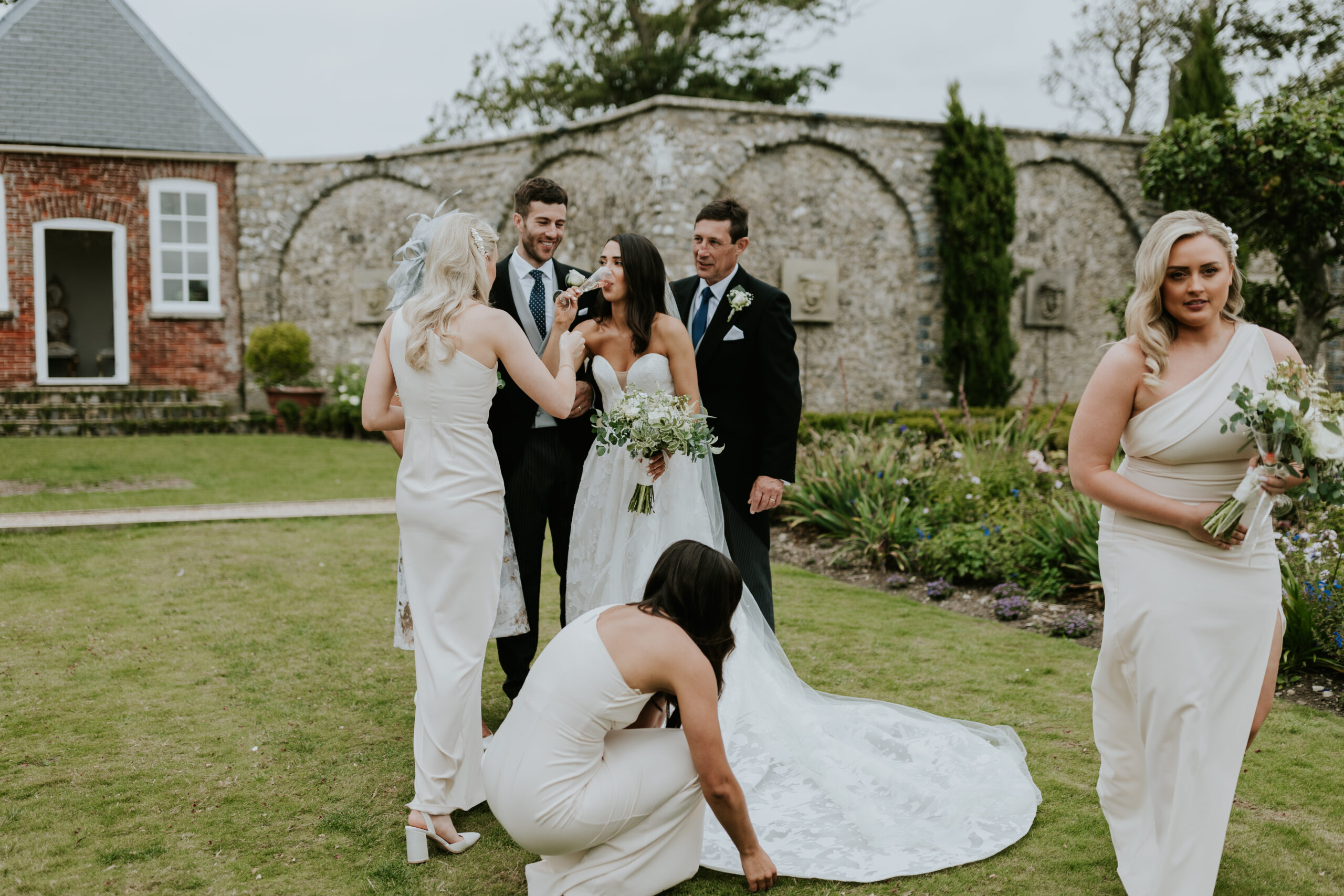 Bride having a sip of Prosecco