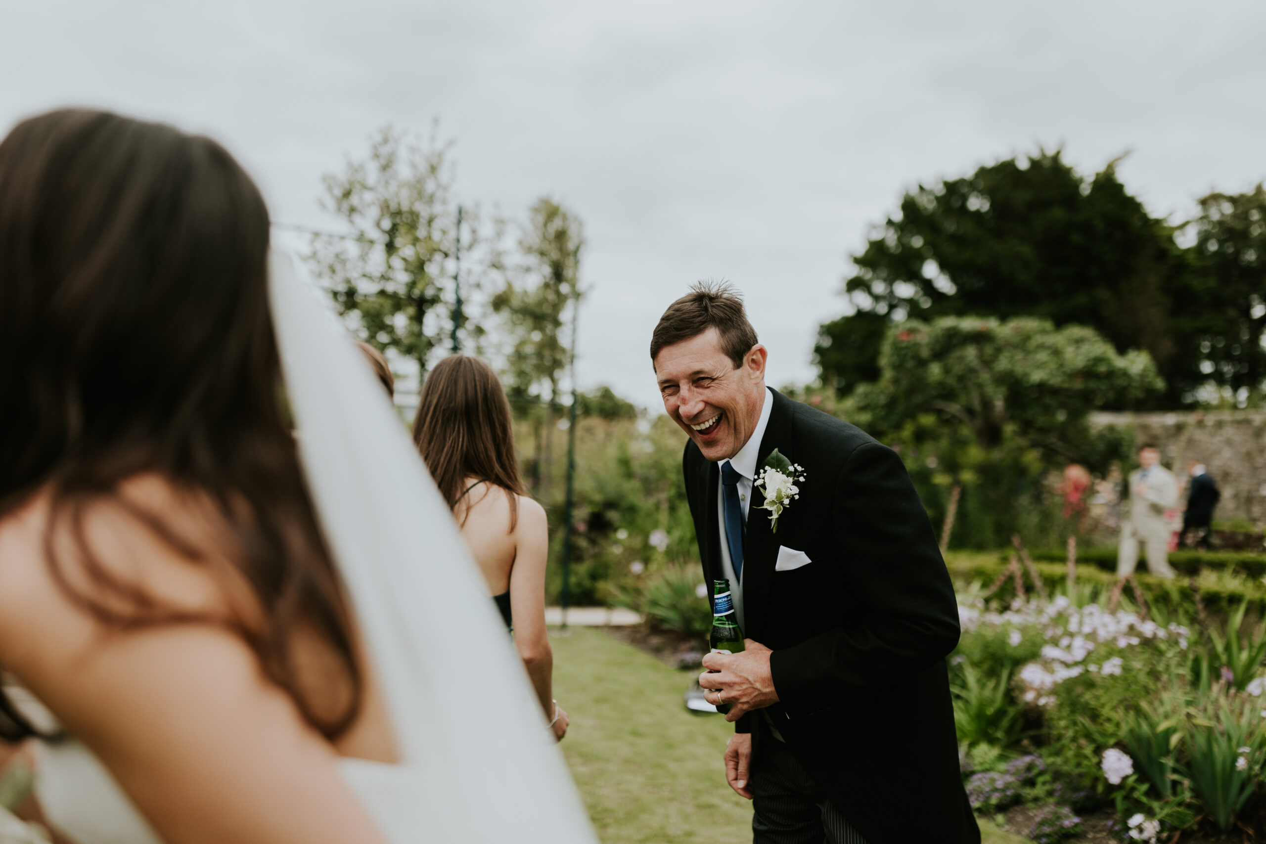 Father of the groom laughing