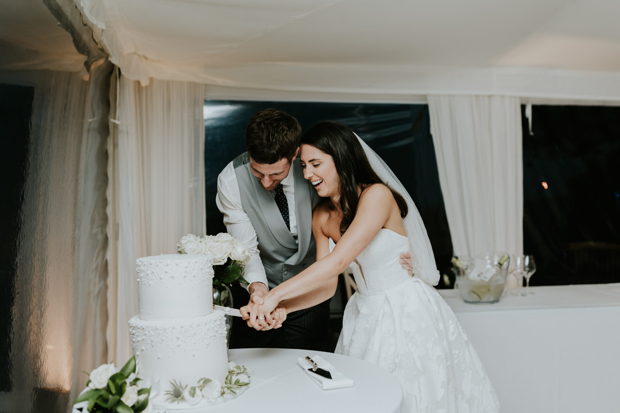 Bride and groom cutting the cake