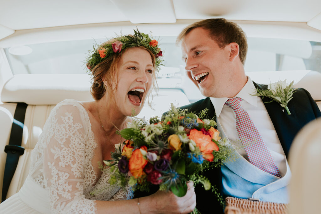 bride and groom laughing